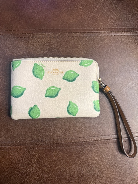Coach Handbags - Coach Cream Wristlet with Green Lemon Motif